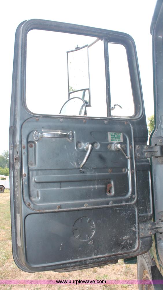 image for item C2737 1985 Mack DM685S roll off truck