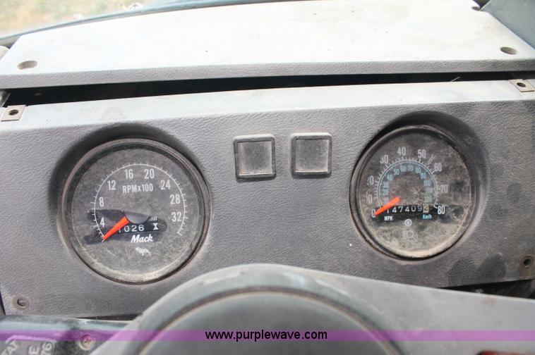 image for item C2737 1985 Mack DM685S roll off truck