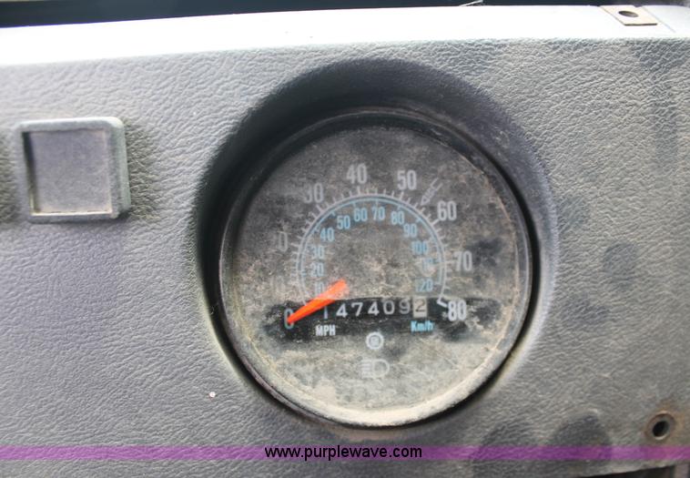 image for item C2737 1985 Mack DM685S roll off truck