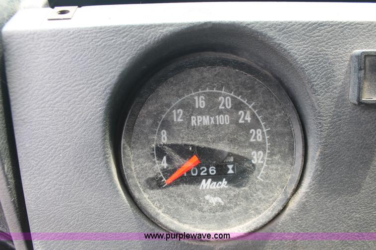 image for item C2737 1985 Mack DM685S roll off truck