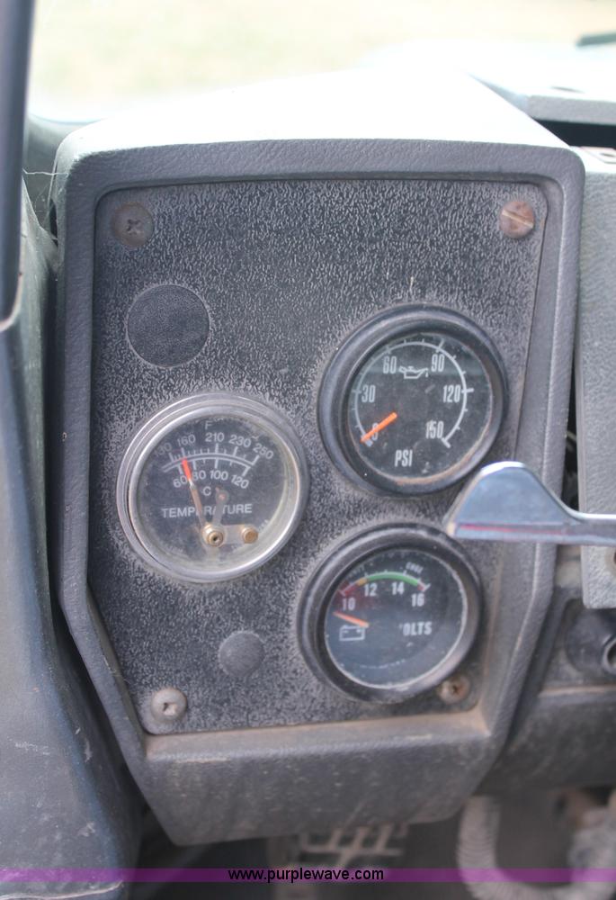 image for item C2737 1985 Mack DM685S roll off truck