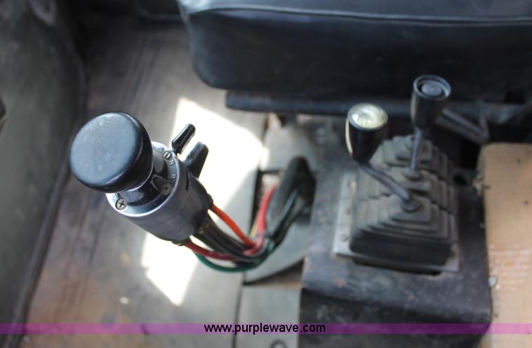 image for item C2737 1985 Mack DM685S roll off truck