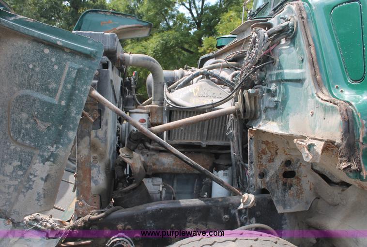 image for item C2737 1985 Mack DM685S roll off truck
