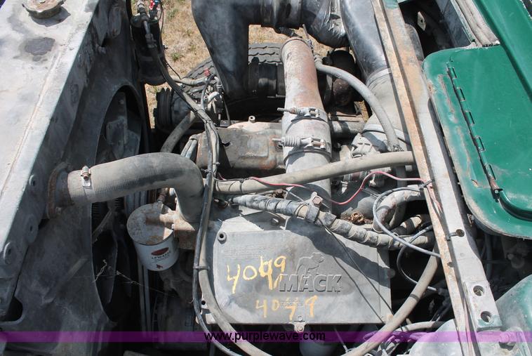 image for item C2737 1985 Mack DM685S roll off truck