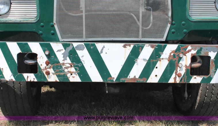 image for item C2737 1985 Mack DM685S roll off truck