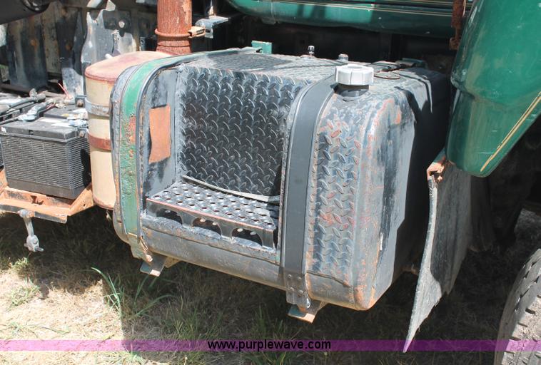 image for item C2737 1985 Mack DM685S roll off truck