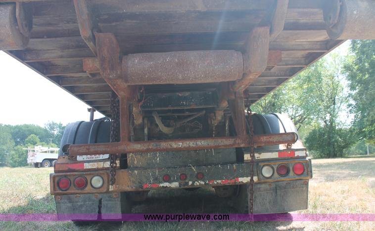 image for item C2737 1985 Mack DM685S roll off truck