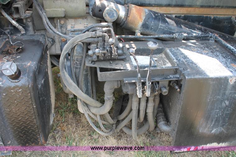 image for item C2737 1985 Mack DM685S roll off truck