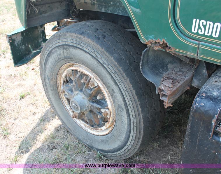 image for item C2737 1985 Mack DM685S roll off truck