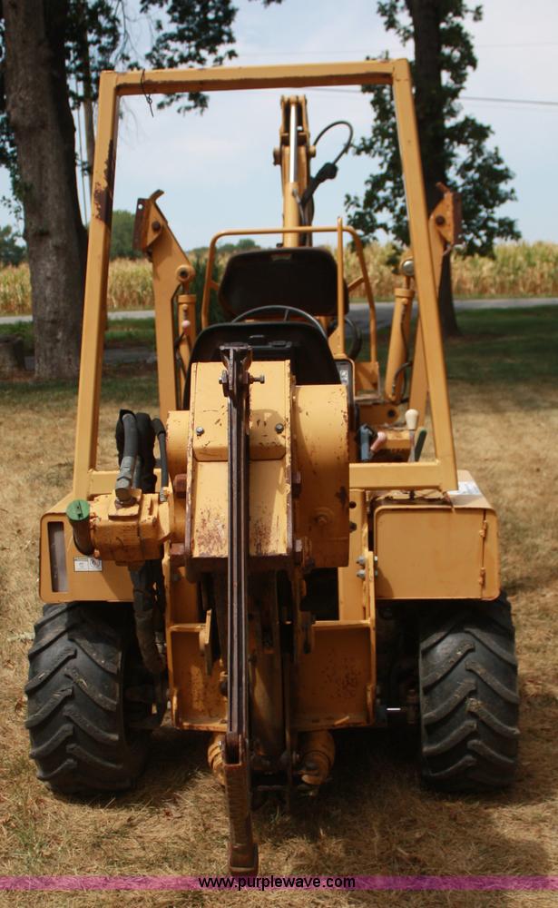 image for item C5754 Vermeer V3550A vibratory plow with backhoe