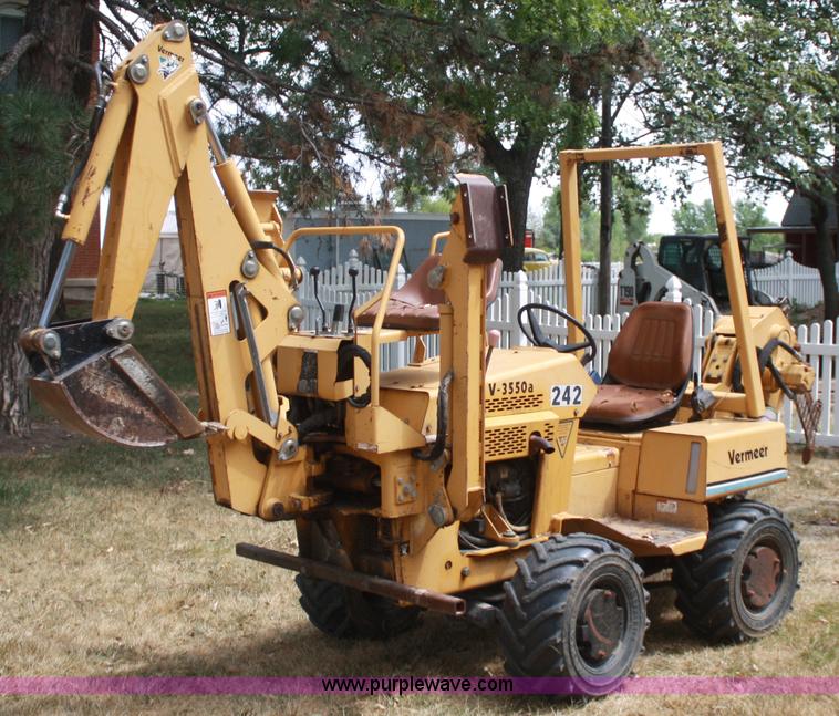 image for item C5754 Vermeer V3550A vibratory plow with backhoe