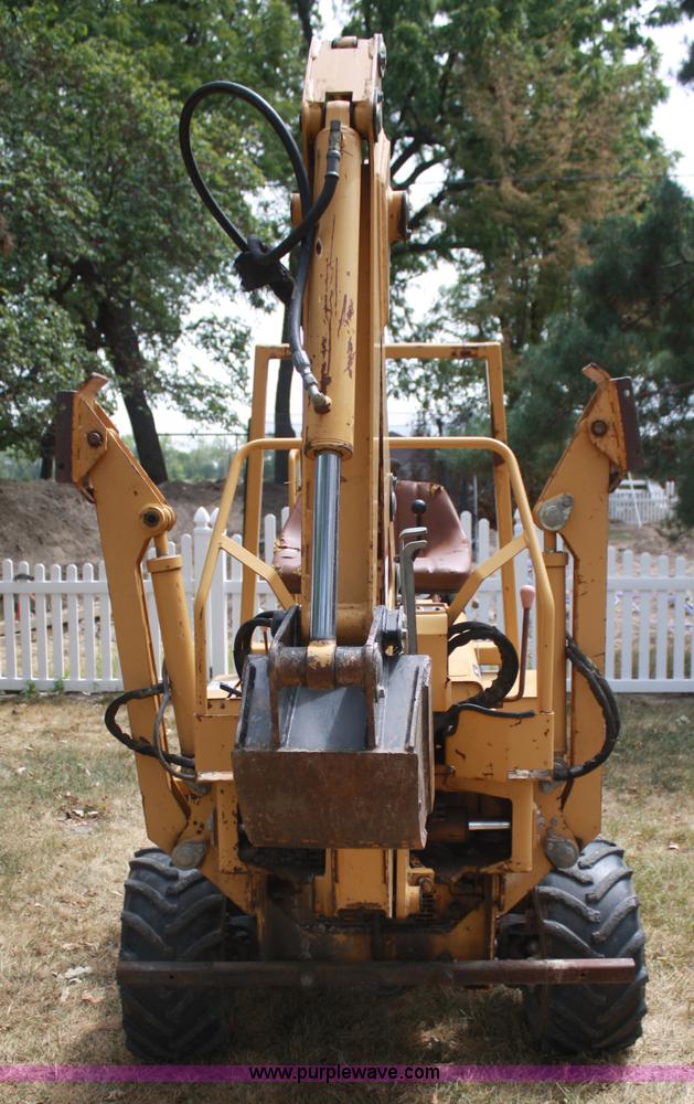 image for item C5754 Vermeer V3550A vibratory plow with backhoe
