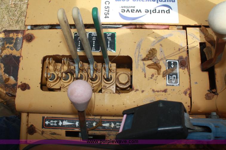 image for item C5754 Vermeer V3550A vibratory plow with backhoe