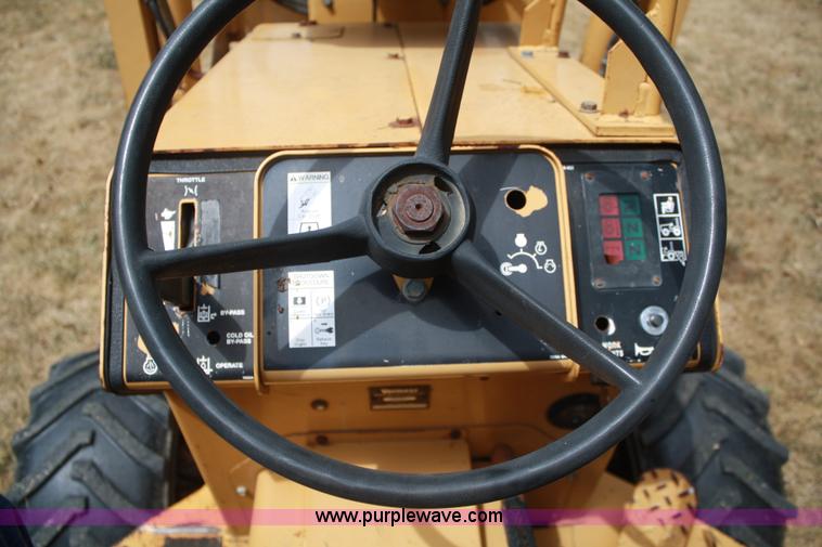 image for item C5754 Vermeer V3550A vibratory plow with backhoe