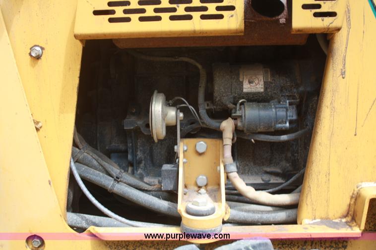 image for item C5754 Vermeer V3550A vibratory plow with backhoe