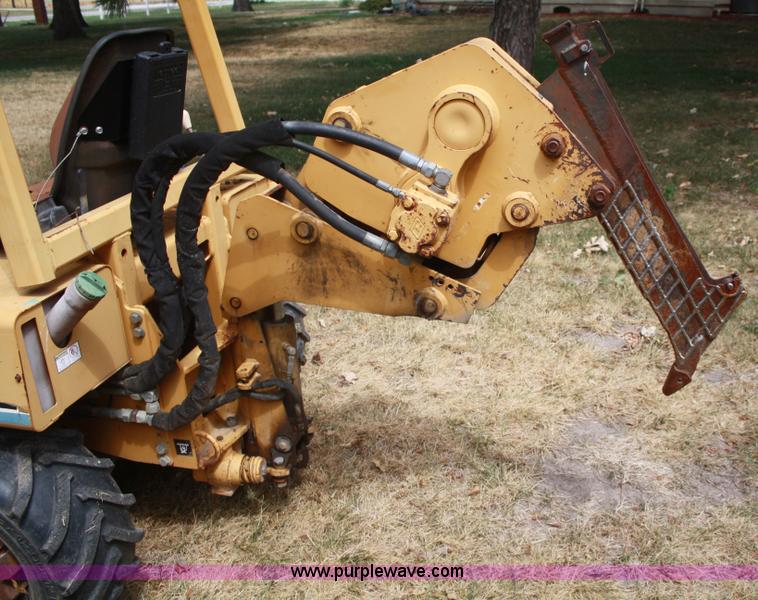 image for item C5754 Vermeer V3550A vibratory plow with backhoe