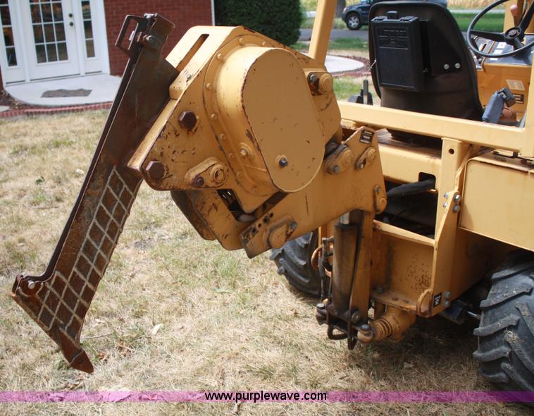 image for item C5754 Vermeer V3550A vibratory plow with backhoe