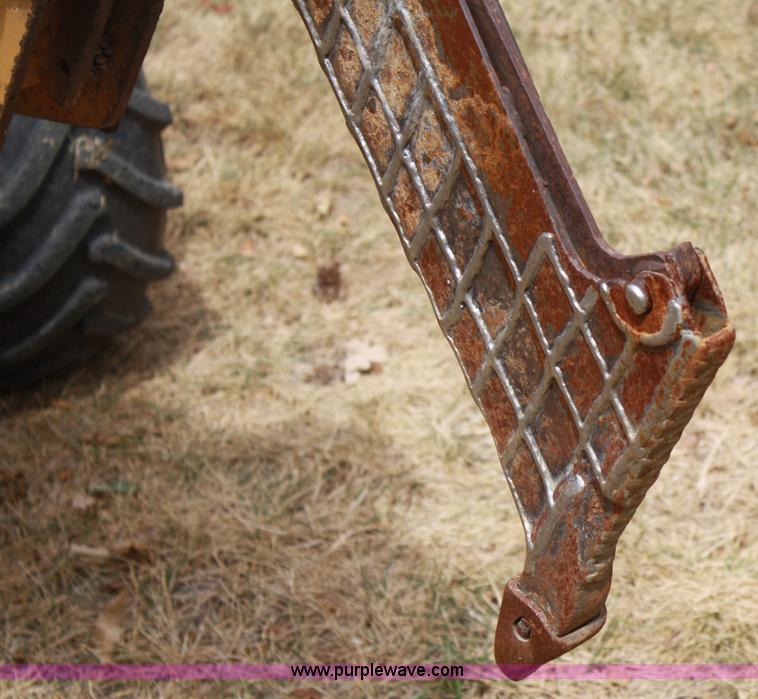 image for item C5754 Vermeer V3550A vibratory plow with backhoe