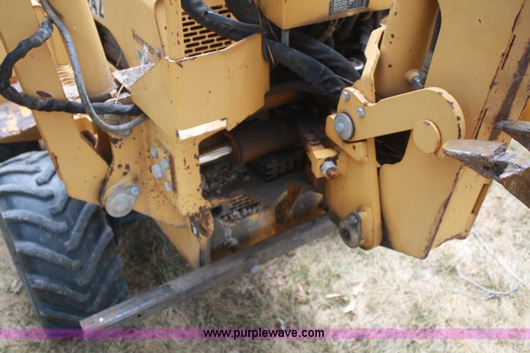 image for item C5754 Vermeer V3550A vibratory plow with backhoe