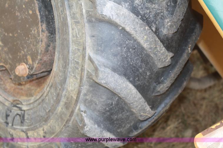 image for item C5754 Vermeer V3550A vibratory plow with backhoe