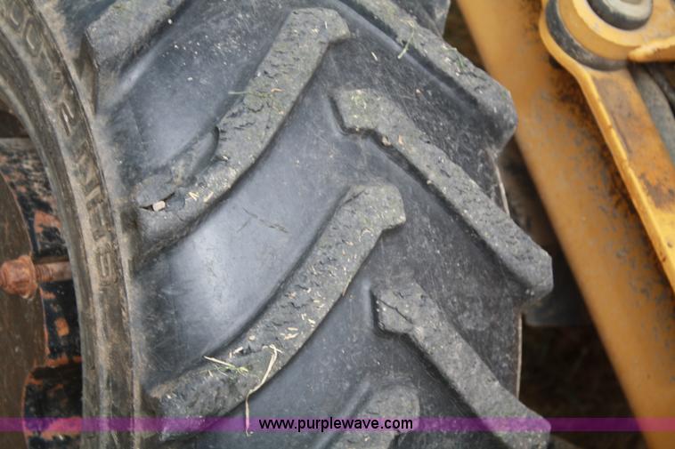 image for item C5754 Vermeer V3550A vibratory plow with backhoe