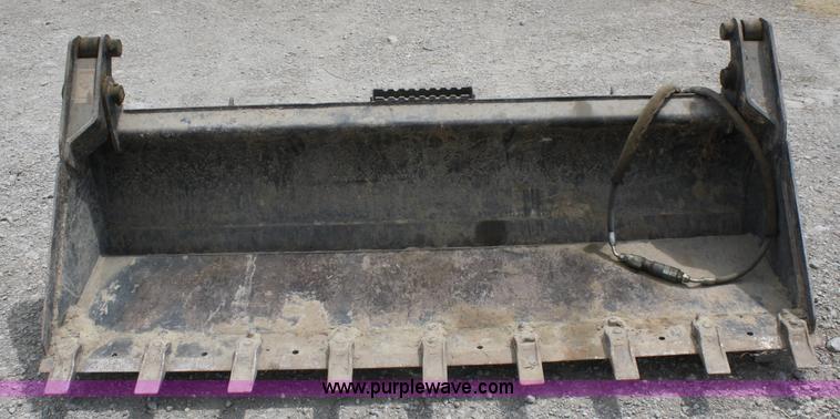 image for item K9817 Caterpillar 4-in-1 skid steer bucket