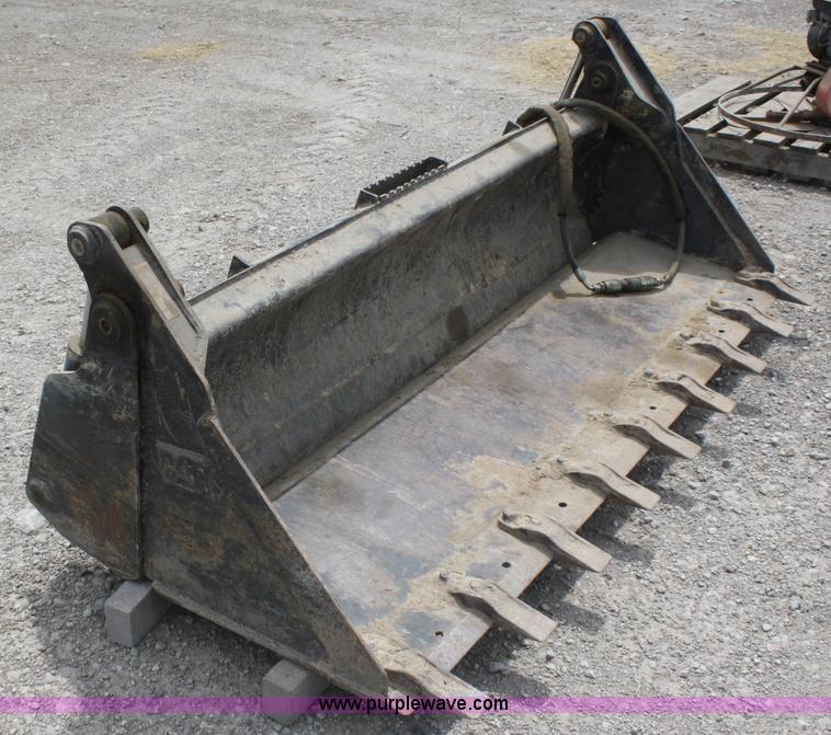 image for item K9817 Caterpillar 4-in-1 skid steer bucket