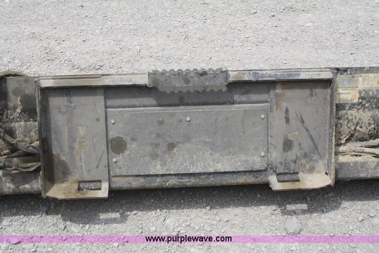 image for item K9817 Caterpillar 4-in-1 skid steer bucket