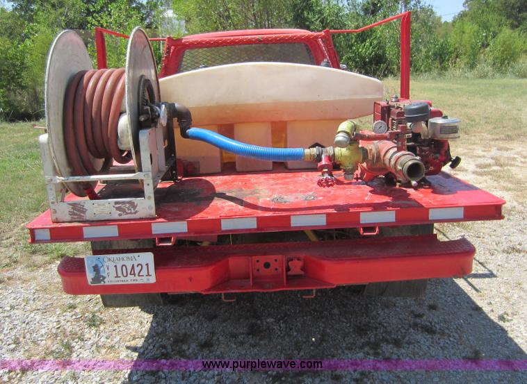 image for item D5605 1977 Dodge W200 flatbed pickup truck