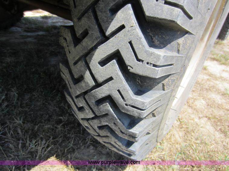 image for item D5605 1977 Dodge W200 flatbed pickup truck