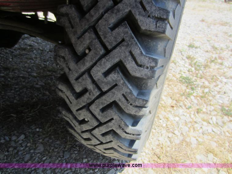 image for item D5605 1977 Dodge W200 flatbed pickup truck