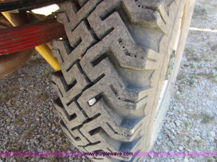 image for item D5605 1977 Dodge W200 flatbed pickup truck