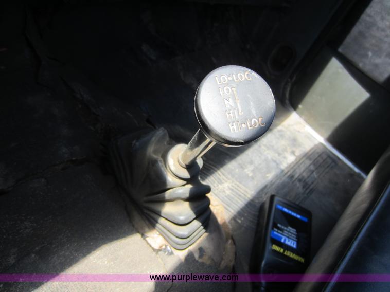 image for item D5605 1977 Dodge W200 flatbed pickup truck