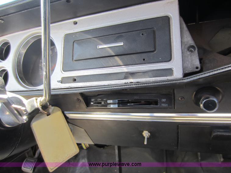 image for item D5605 1977 Dodge W200 flatbed pickup truck