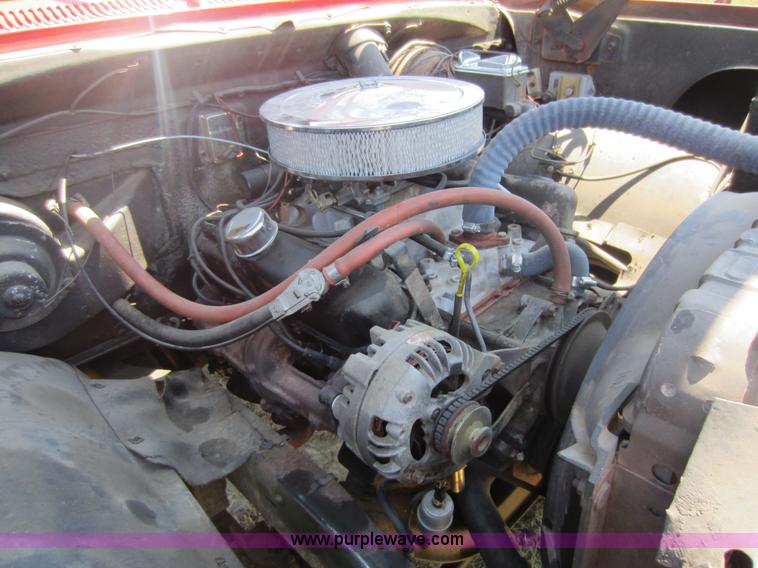 image for item D5605 1977 Dodge W200 flatbed pickup truck