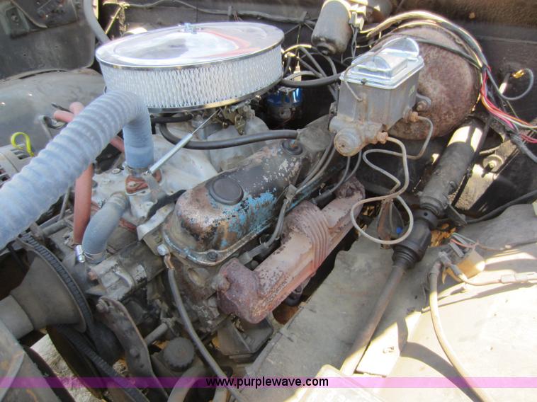 image for item D5605 1977 Dodge W200 flatbed pickup truck