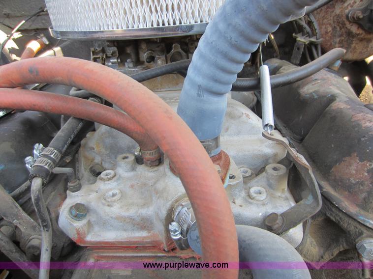 image for item D5605 1977 Dodge W200 flatbed pickup truck