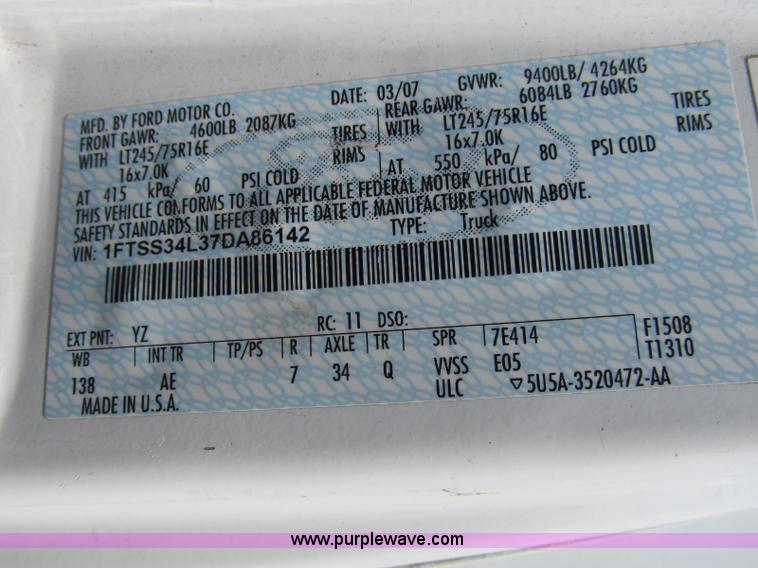 image for item B2830 2007 Ford E350 cargo van with bucket attachment