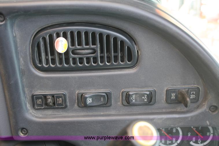 image for item B6876 2006 Freightliner Business Class M2 rollback truck