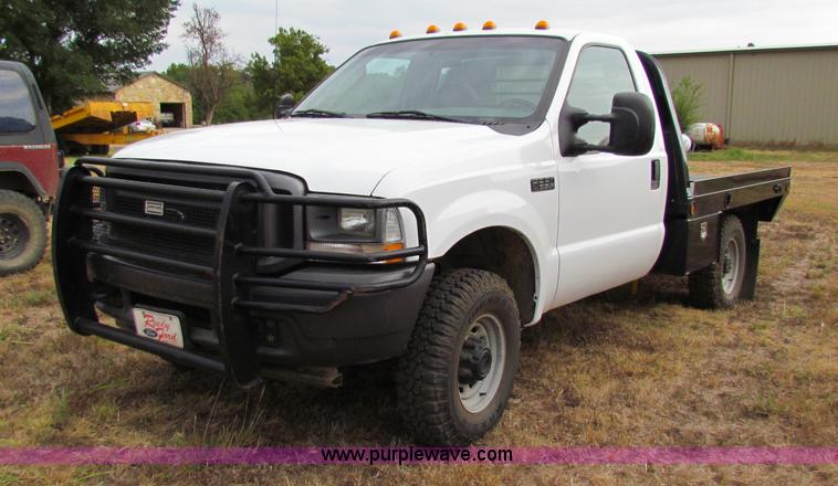 image for item B7474 2003 Ford F350 XL Super Duty flatbed pickup truck