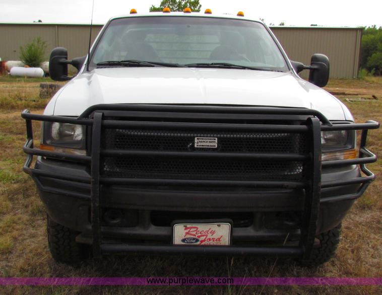 image for item B7474 2003 Ford F350 XL Super Duty flatbed pickup truck