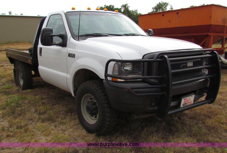 image for item B7474 2003 Ford F350 XL Super Duty flatbed pickup truck