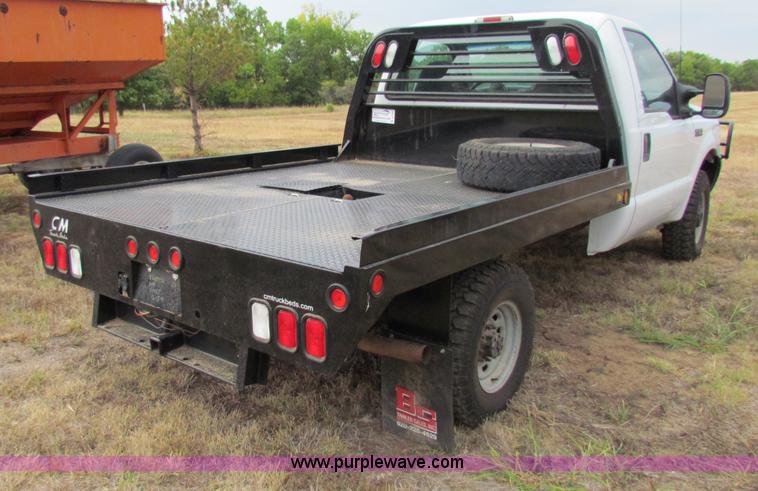 image for item B7474 2003 Ford F350 XL Super Duty flatbed pickup truck