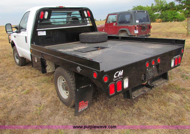 image for item B7474 2003 Ford F350 XL Super Duty flatbed pickup truck