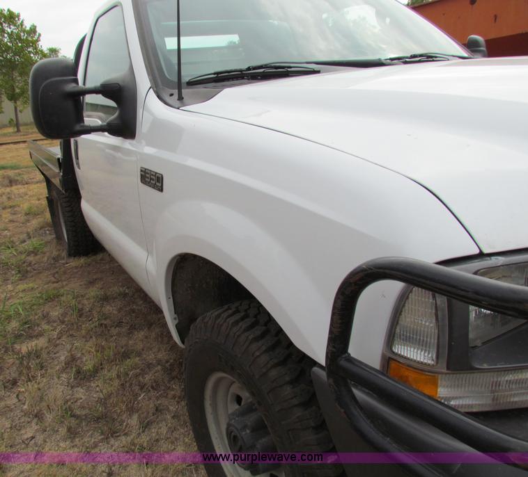 image for item B7474 2003 Ford F350 XL Super Duty flatbed pickup truck
