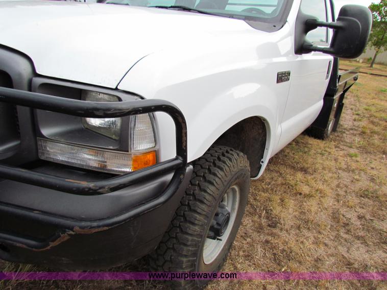 image for item B7474 2003 Ford F350 XL Super Duty flatbed pickup truck