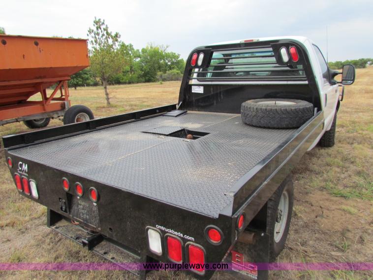image for item B7474 2003 Ford F350 XL Super Duty flatbed pickup truck
