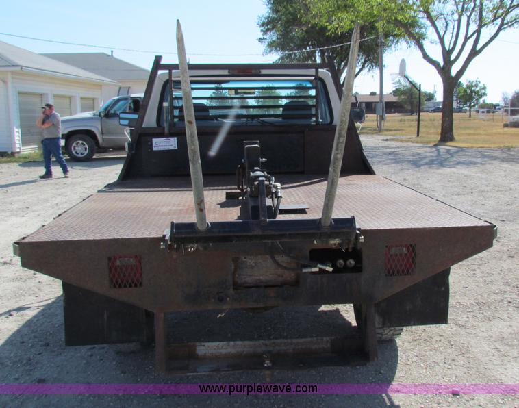 image for item B7489 1995 Ford F250 XL flatbed pickup truck