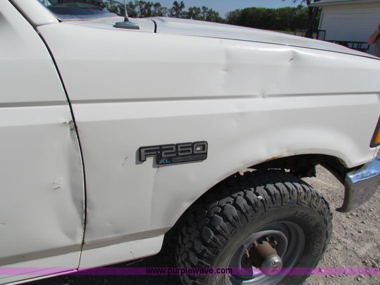 image for item B7489 1995 Ford F250 XL flatbed pickup truck