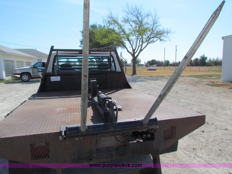 image for item B7489 1995 Ford F250 XL flatbed pickup truck